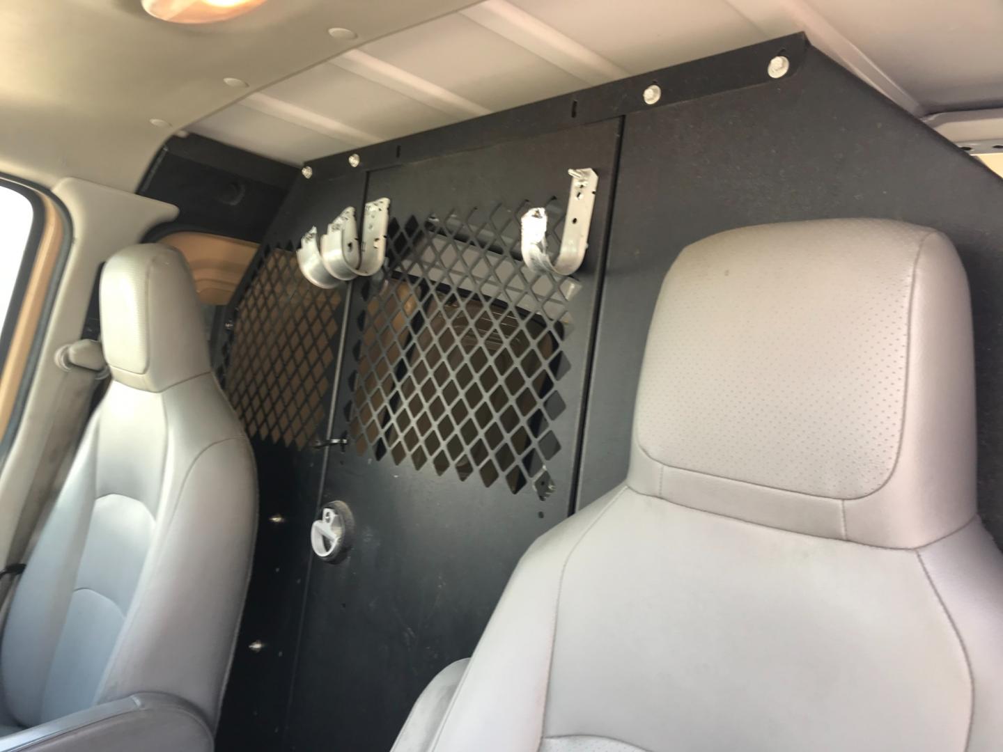 2011 Tan /Gray Ford E-Series Van E250 (1FTNE2EW5BD) with an 4.8 V8 engine, Automatic transmission, located at 577 Chester Pike, Prospect Park, PA, 19076, (610) 237-1015, 39.886154, -75.302338 - 2011 Ford E250 Cargo Van: Ladder racks, shelving, heavy duty partition, power inverter, fully metal body, FLEET MAINTAINED, runs LIKE NEW! This vehicle comes inspected and has been given a bumper to bumper safety check. It is very clean, reliable, and well maintained. We offer a unique pay plan t - Photo#15